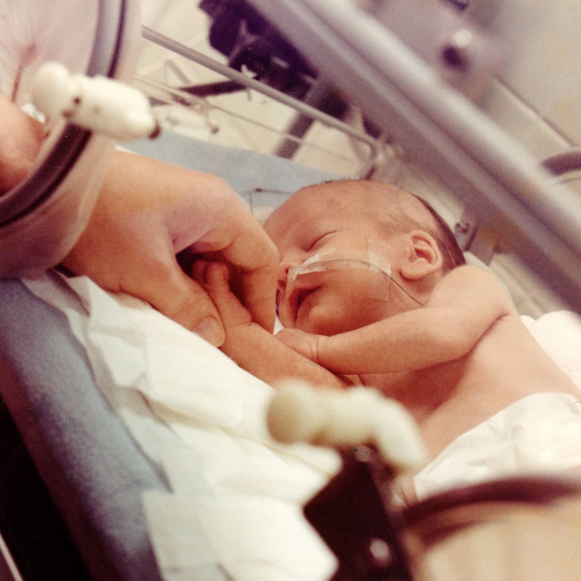 Baby lying on hospital bed