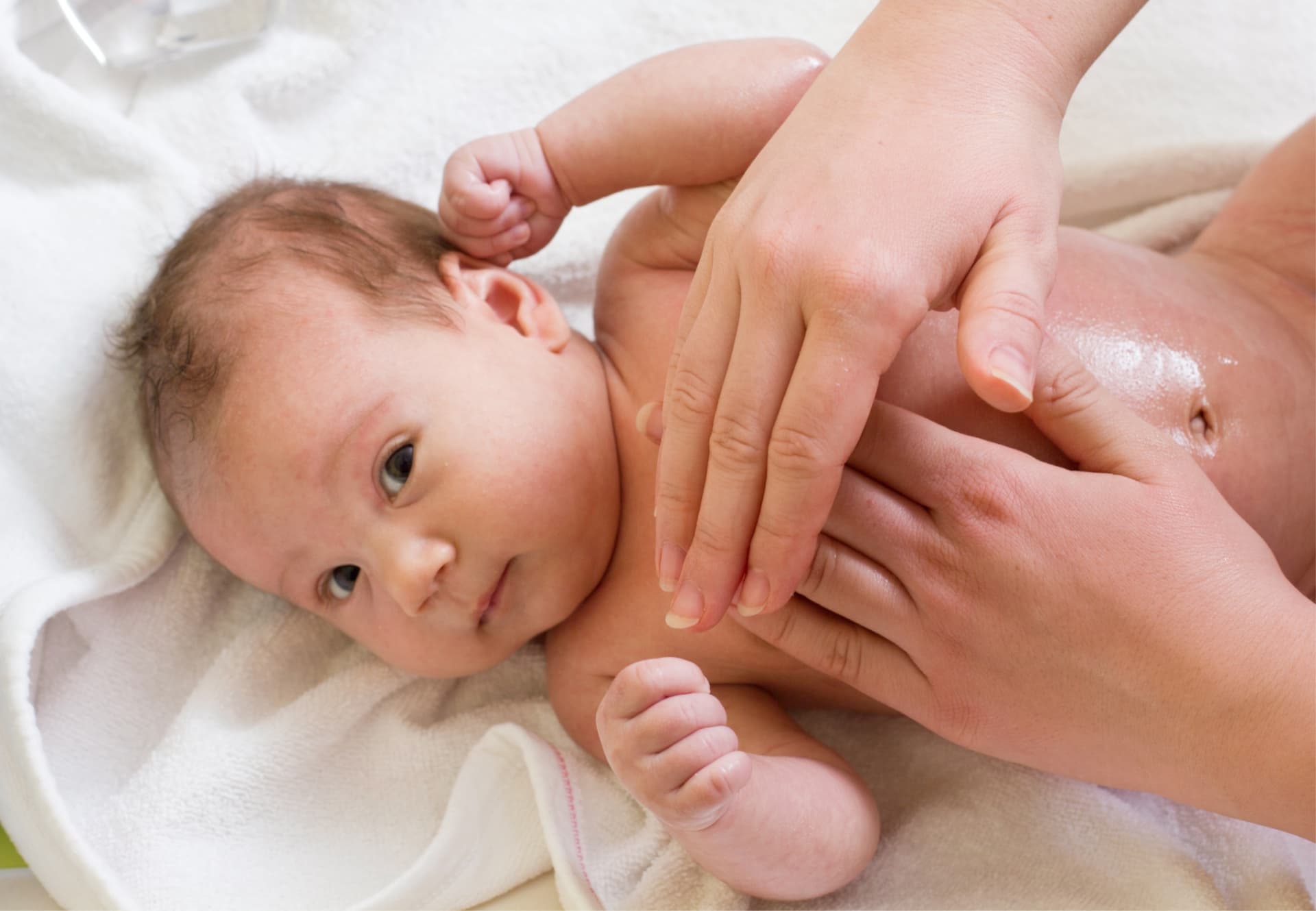 Baby receives a full body massage